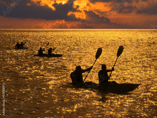 Photo: Silhouette of kayakers at sunset Silhouette of kayakers at sunset