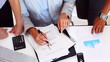 Video: Business plans - Colleagues go over documents together in the wo Business plans - Colleagues go over documents together in the wo