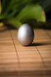 Silver Easter egg on wooden background