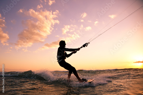 Photo: Kite boarding. Kitesurf freestyle Kite boarding. Kitesurf freestyle