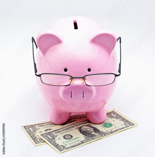 Photo: Tirelire avec lunettes sur billets dollar US Tirelire avec lunettes sur billets dollar US