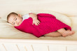 Foto: Sleeping baby covered with knitted blanket Sleeping baby covered with knitted blanket