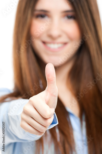 Photo: Beautiful businesswoman giving thumbs up Beautiful businesswoman giving thumbs up