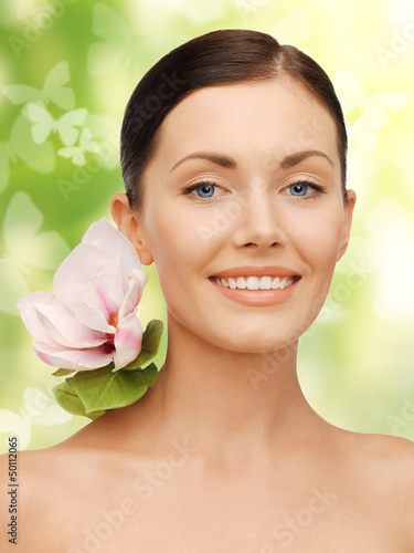 Photo: lovely woman with lily flower and butterflies lovely woman with lily flower and butterflies