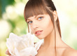 Photo: beautiful woman with orchid flower beautiful woman with orchid flower