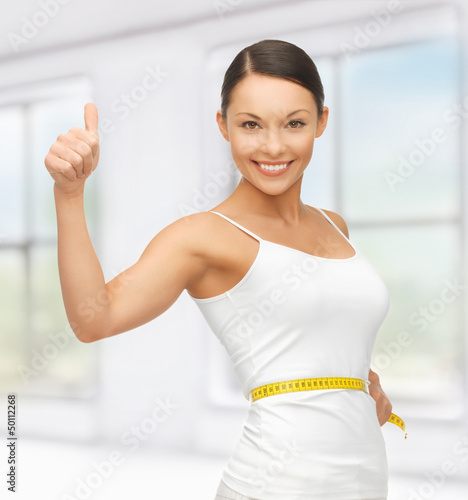 Photo: woman with measuring tape woman with measuring tape
