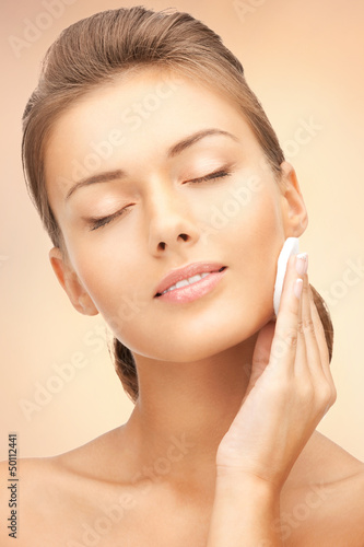 Photo: beautiful woman with cotton pad beautiful woman with cotton pad