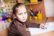 Cute little girl writing her homework