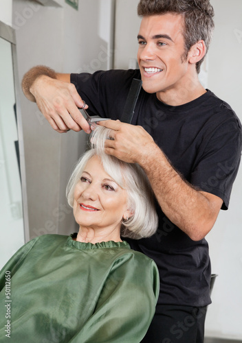Photo: Hairstylist Cutting Client's Hair In Parlor Hairstylist Cutting Client's Hair In Parlor
