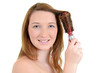 teen girl curling her hair