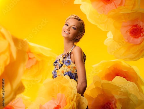 Photo: Beautiful young blond woman in colourful dress Beautiful young blond woman in colourful dress