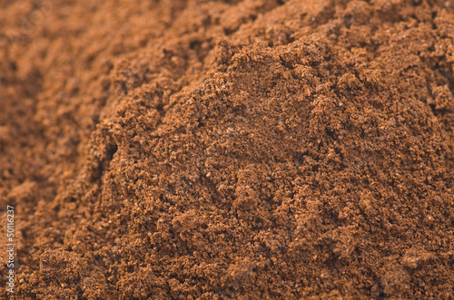 Photo: coffee powder close up on the white background coffee powder close up on the white background