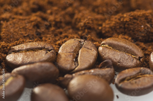 Photo: coffee powder close up on the white background coffee powder close up on the white background