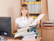  businesswoman reading  documents  in office