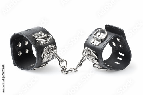 Photo: black leather handcuffs isolated on white background black leather handcuffs isolated on white background
