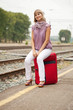 woman  waiting  train on  railroad