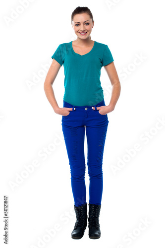 Photo: Pretty woman with hands in jeans pocket Pretty woman with hands in jeans pocket