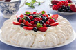 Cake "Pavlova" with cream and berries.
