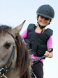 Horse riding - portrait of lovely equestrian on a horse