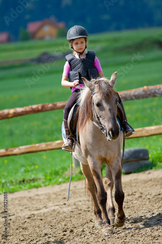 Photo: Horse riding - lovely equestrian on a horse Horse riding - lovely equestrian on a horse