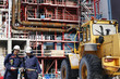 workers, bulldozer and construction plant