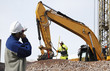 bulldozer and construction workers in action