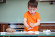 Little boy helping with baking cookies