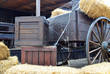 Old cart and wooden boxes in a barn