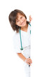 female doctor showing blank board smiling