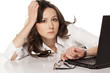 secretary with a laptop looking at his watch in boredom on white