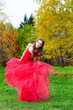 A beautiful brunette in red dress