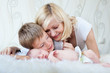 Young mother looking at her sleeping baby