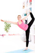 Young beautiful woman stretching at home