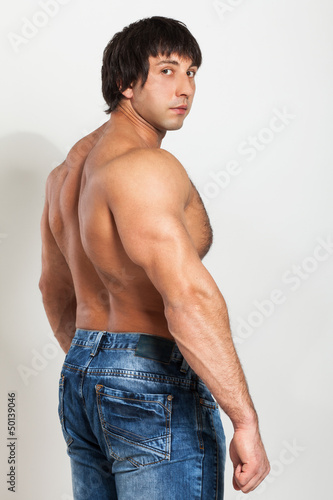Photo: Muscular young man with naked torso Muscular young man with naked torso
