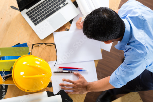 Photo: Architect working at home Architect working at home