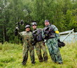 Photo: Paintball players in full gear at the shooting range Paintball players in full gear at the shooting range