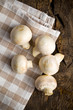 Champignon mushrooms on wooden table.