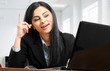 Businesswoman having an idea while working