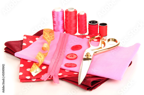 Photo: Sewing accessories and fabric isolated on white Sewing accessories and fabric isolated on white