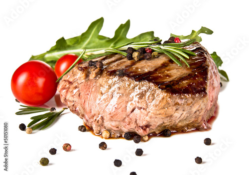 Photo: Beef steak medium grilled, isolated on white background Beef steak medium grilled, isolated on white background