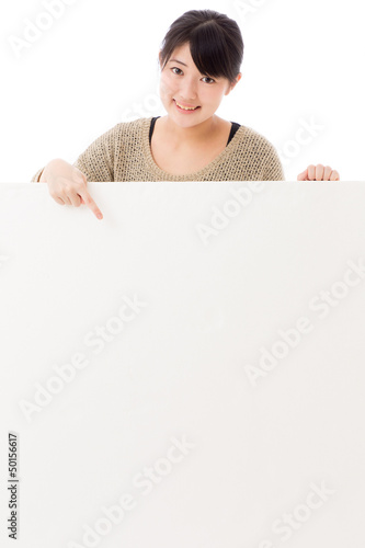 Photo: a young asian woman with blank whiteboard a young asian woman with blank whiteboard