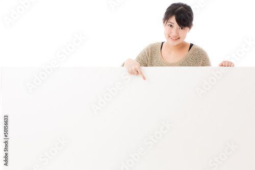 Photo: a young asian woman with blank whiteboard a young asian woman with blank whiteboard