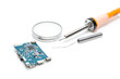 soldering iron with microscheme on white