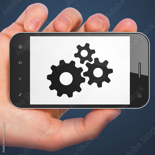 Photo: Advertising concept: smartphone with Gears. Advertising concept: smartphone with Gears.