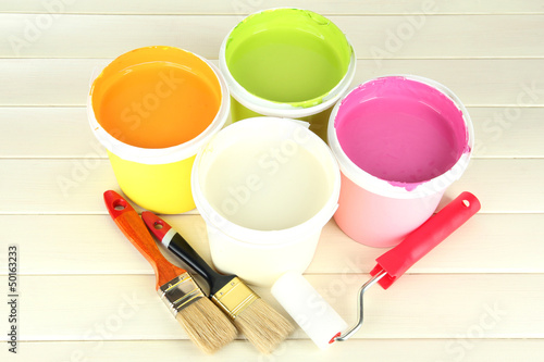 Photo: Set for painting: paint pots, brushes, paint-roller Set for painting: paint pots, brushes, paint-roller