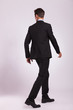 back view of business man walking