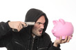 Photo: man with gun and pink piggy bank man with gun and pink piggy bank