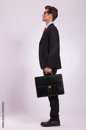 Photo: serious man with suitcase serious man with suitcase