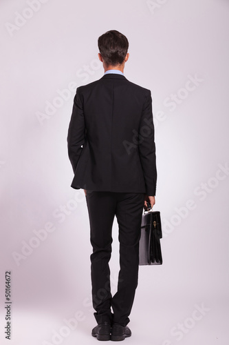 Photo: business man & brief, back view business man & brief, back view