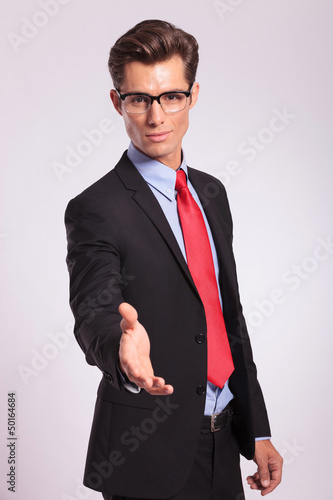 Photo: business man offering handshake business man offering handshake